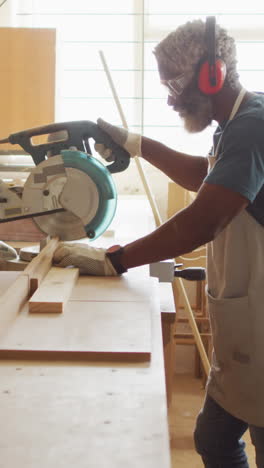 african american carpenter at work in a well-lit workshop