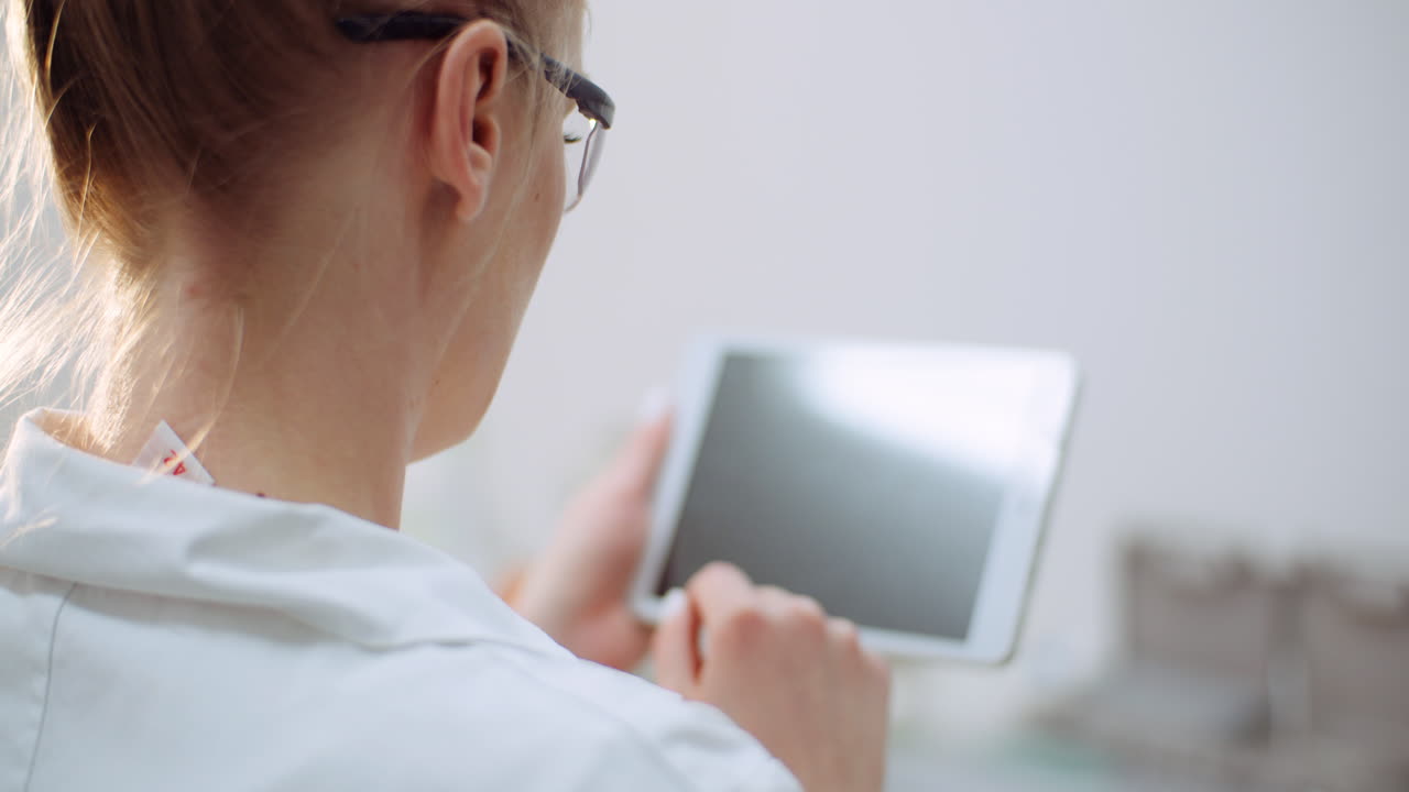 Female Doctor Using Digital Tablet At Dental Clinic 2