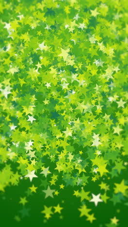Colorful green confetti flying randomly. Explosion of stars shape. Loop animation. Vertical video.
