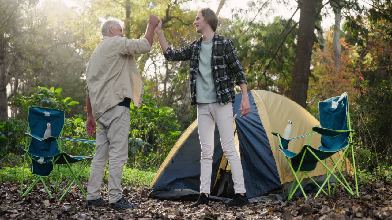 Father and son camping in the woods