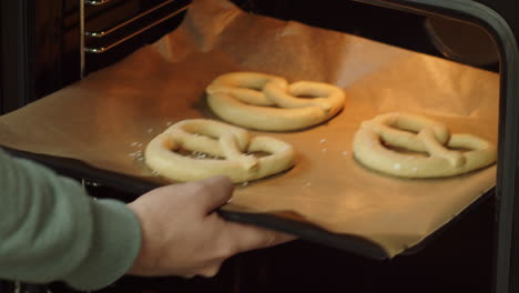 homemade pretzels being put in the oven