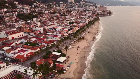 El-Malecon-boardwalk-aerial-drone-view-approach-Mexico,-Jalisco,-Puerto-Vallarta,-Old-town