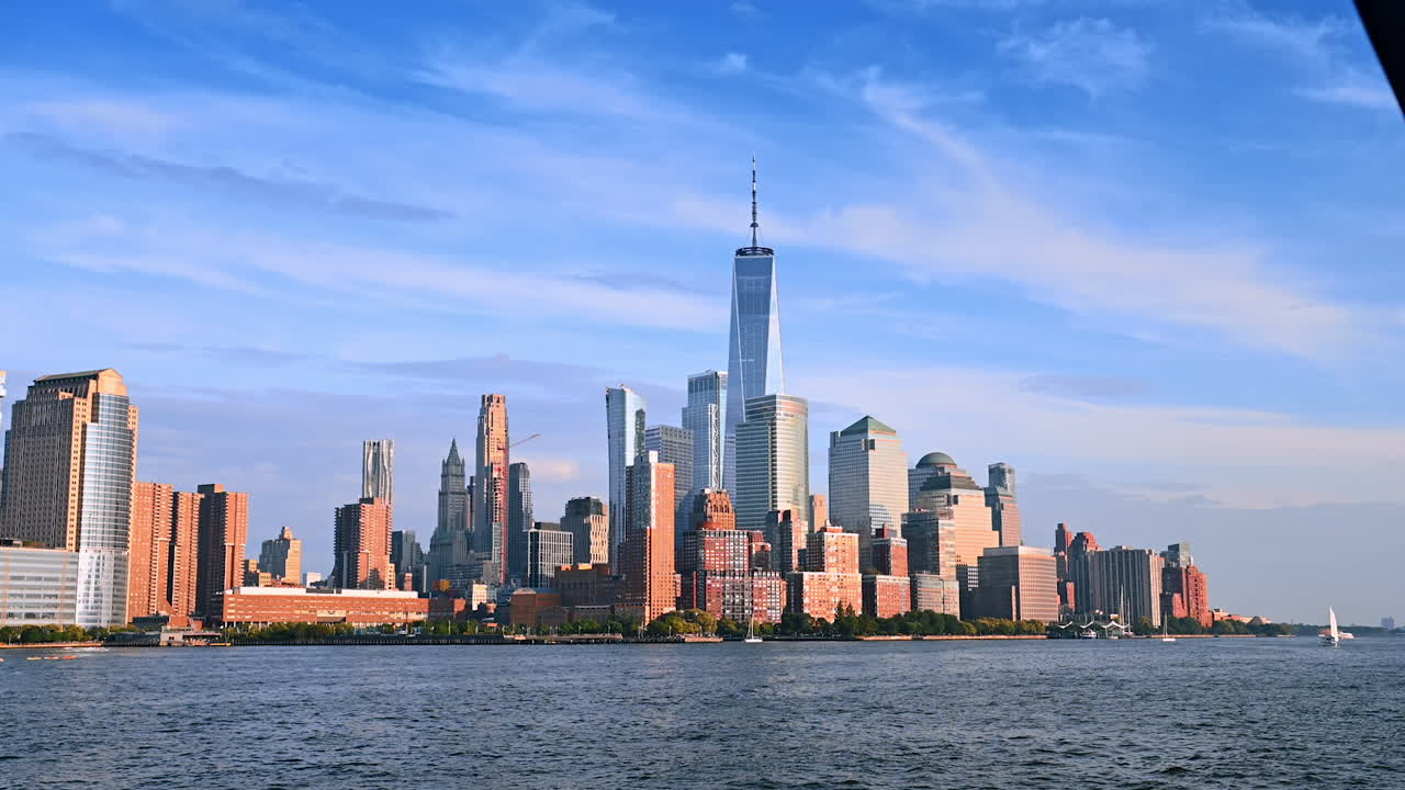 High-rise skyline of New York, USA. Low angle view at the modern buildings from the river