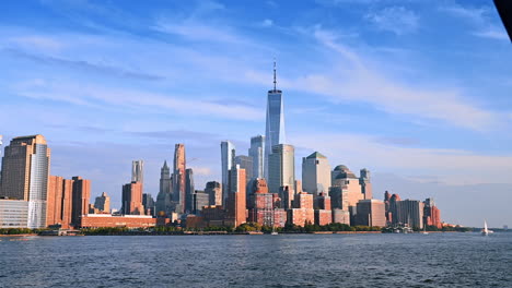 high-rise skyline of new york, usa. low angle view at the modern buildings from the river
