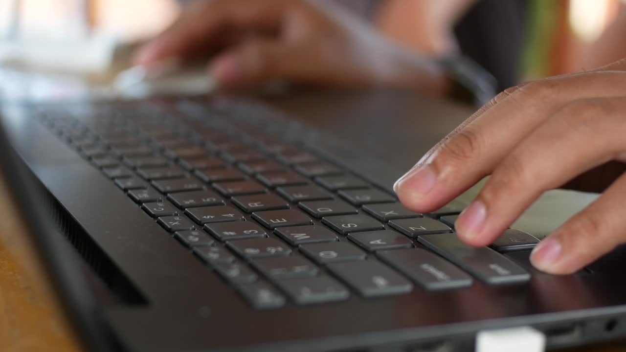 close up of hands typing on a laptop. working with laptop