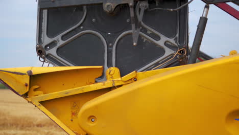 harvester mower mechanism on field. combine harvester moves on field. agricultural harvesting works. large harvester during seasonal works. agricultural business.