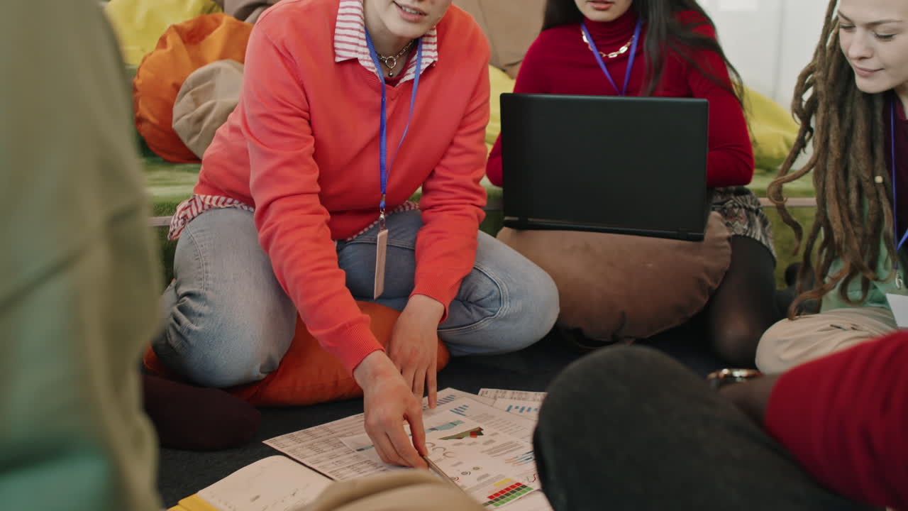 Slowmo of Start-Up Workers Discussing Documents