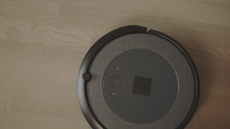 A-Robot-Vacuum-Carrying-out-its-Task---Close-Up
