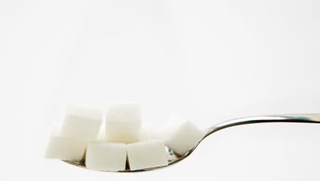 sugar cubes vanishing from teaspoon