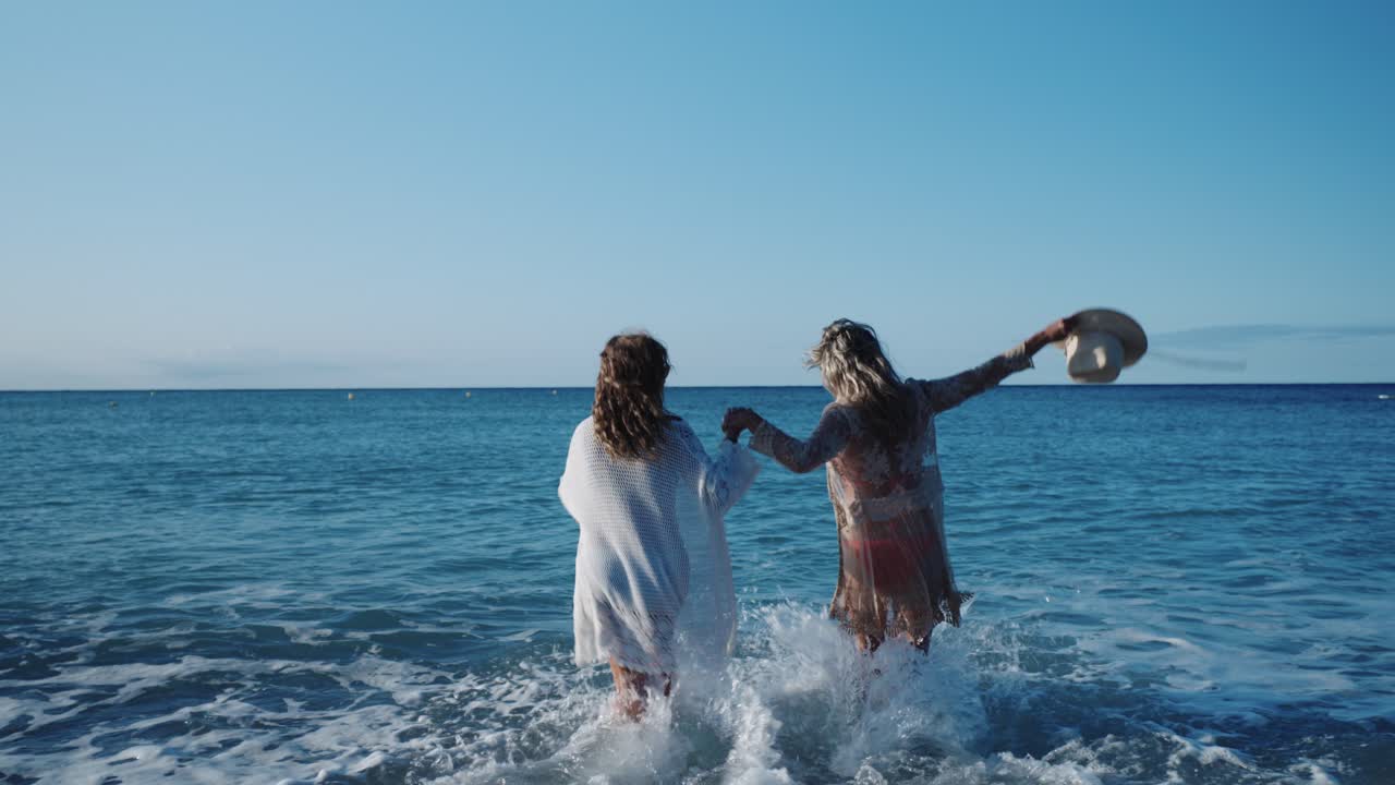 Two Women Enjoying a Sunny Day at the Beach