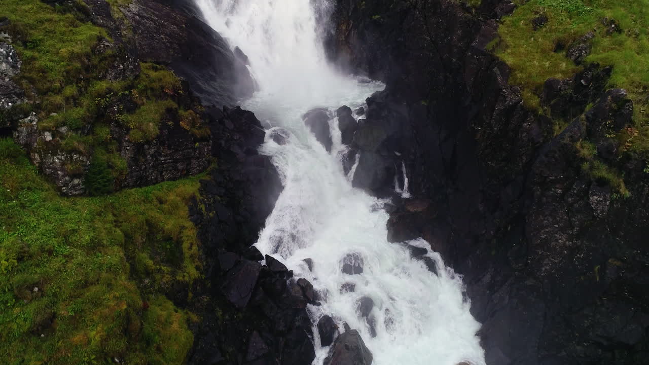Aerial Forward Dolly revealing Large Step Down of Låtefossen at Dusk