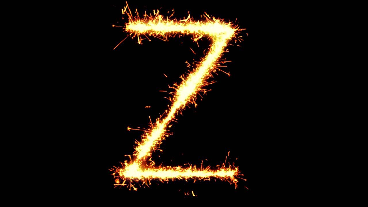 Lettera Z scritta con scintille luminose, particelle glitterate e fuochi d'artificio su sfondo nero in loop 4K.