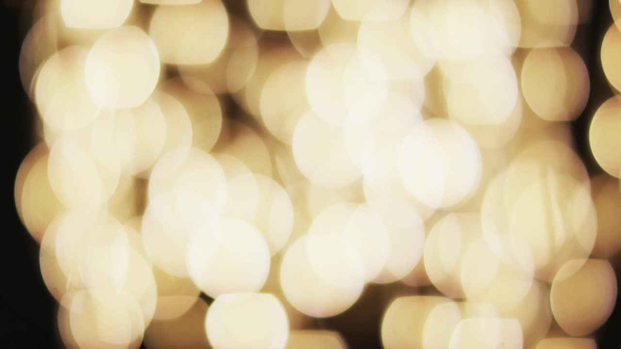 video de puntos de luz bokeh amarillos parpadeantes con espacio de copia