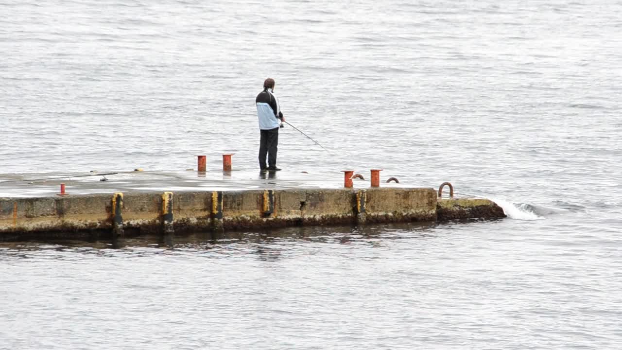 man fishing in sea
