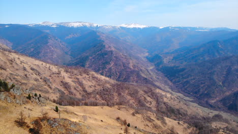 scenic mountain landscape with snow-capped peaks and valleys