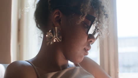 close-up view of fashionable african woman looking around