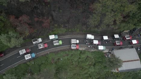 overhead view of trucks in traffic jam on mountain road on java, idn