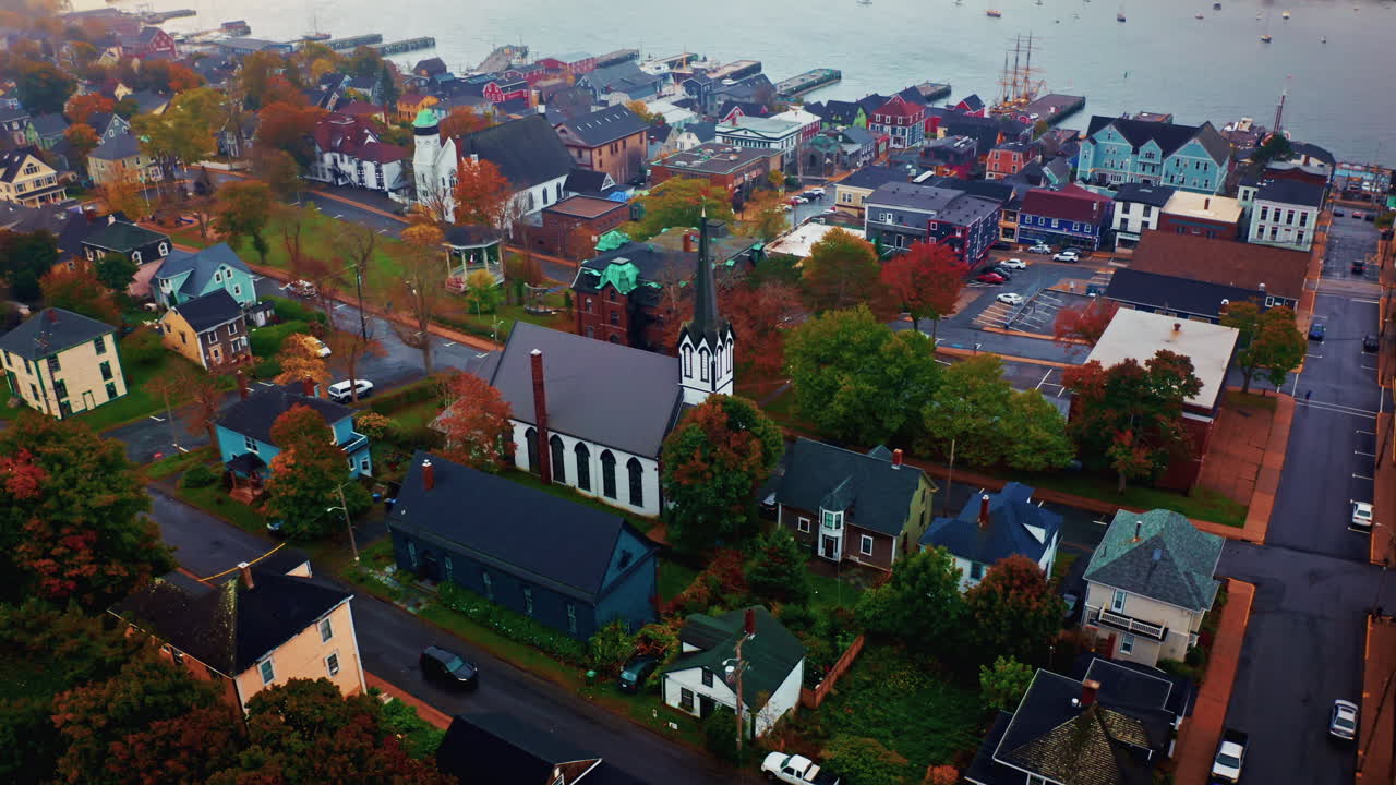 Aerial drone shot over the local town of Lunenburg in Nova Scotia, Canada. Fishing lobster town. Foggy misty day.