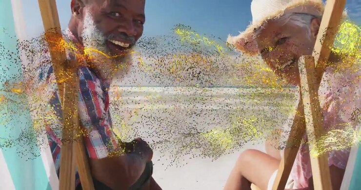 Travel ad showing couple leaning turning on beach seats as golden particles drifting evoking smiles