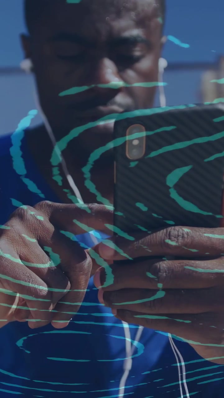 Vertical video: Man tapping phone listening via wired buds, tech turquoise swirl moving over face