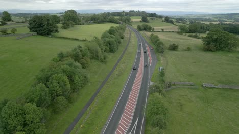 busy rural road a66 cutting through green summer landscape