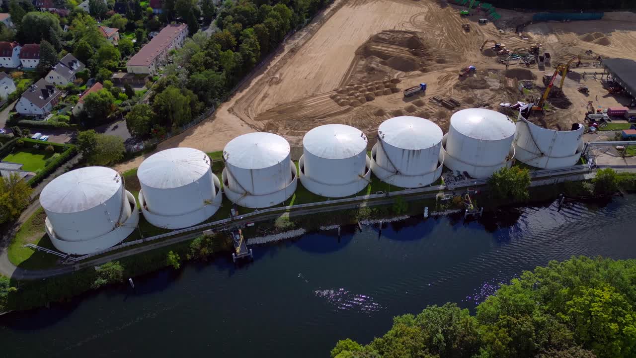 Decommissioning of Storage depot for petroleum products storage silos and containers. Industrial storage tanks holding oil and gas products. Fabulous aerial view flight