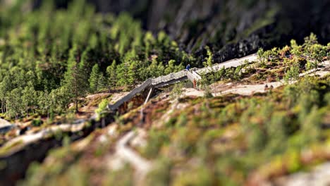 A-aerial-view-of-the-newly-built-bridge-above-the-magnificent-Voringsfossen-waterfall-in-Hardangervidda-national-park,-Norway