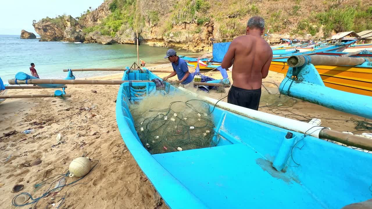 Local Indonesia fisherman preparing net, slow motion view