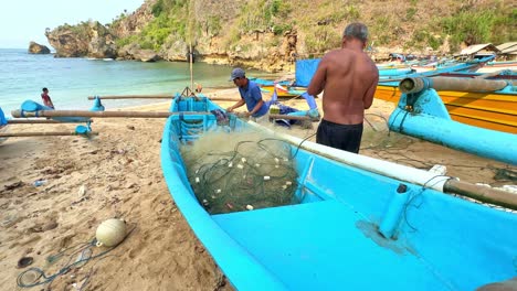 local indonesia fisherman preparing net, slow motion view