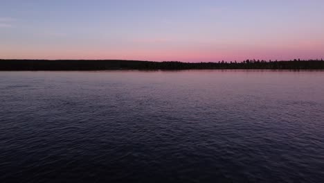 picturesque evening dusk blue hour aerial over calm lake in sweden