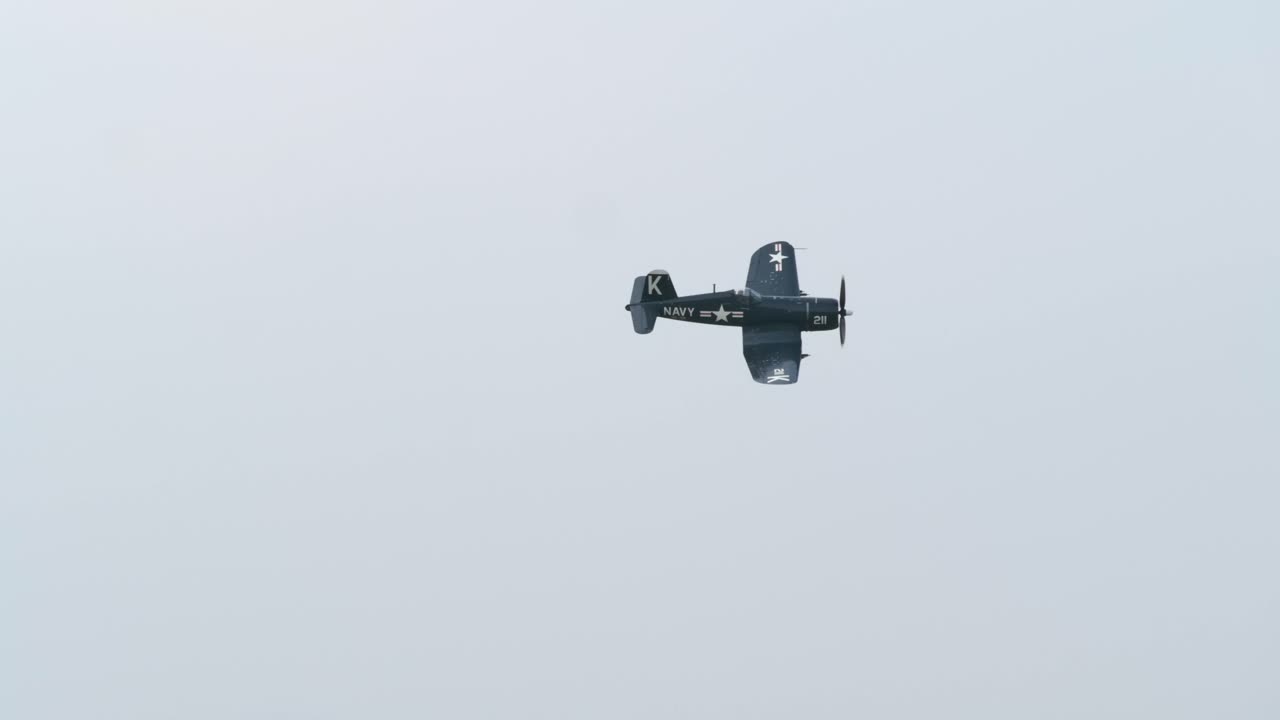 Flyby of a Navy F4U Corsair World War II Fighter Airplane TRACK