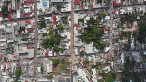 Aerial-birds-eye-overhead-top-down-panning-view-of-town-with-streets-and-blocks-of-houses.-Square-pattern-of-city.-Valladolid,-Mexico