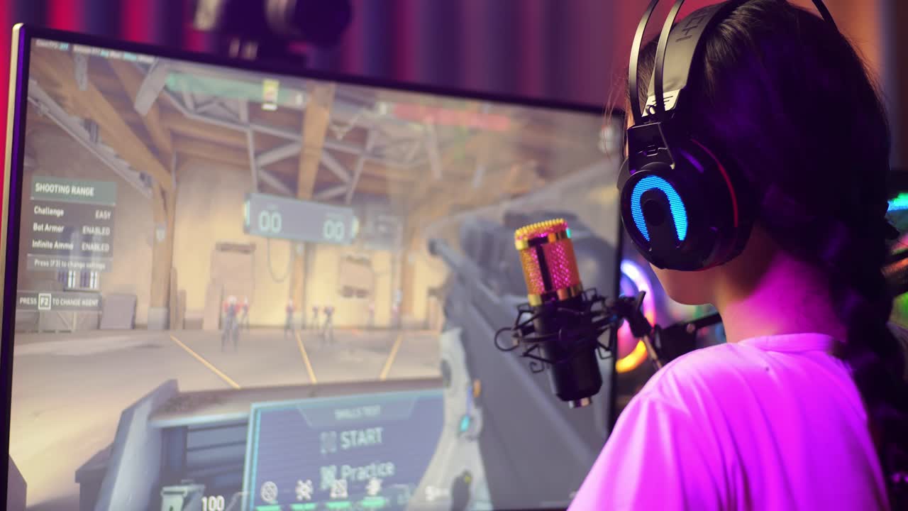 Close Up Back View Of Asian Girl Streamer Playing Game Over Network On Personal Computer. Yawning And Sleeping, Live Stream Video Game, Desk Illuminated By Rgb Led Strip Light