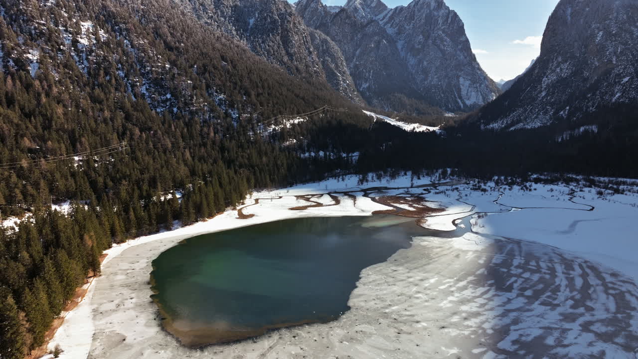 Aerial drone view of the Toblacher See lake in the municipality of Toblach in South Tyrol, Italy