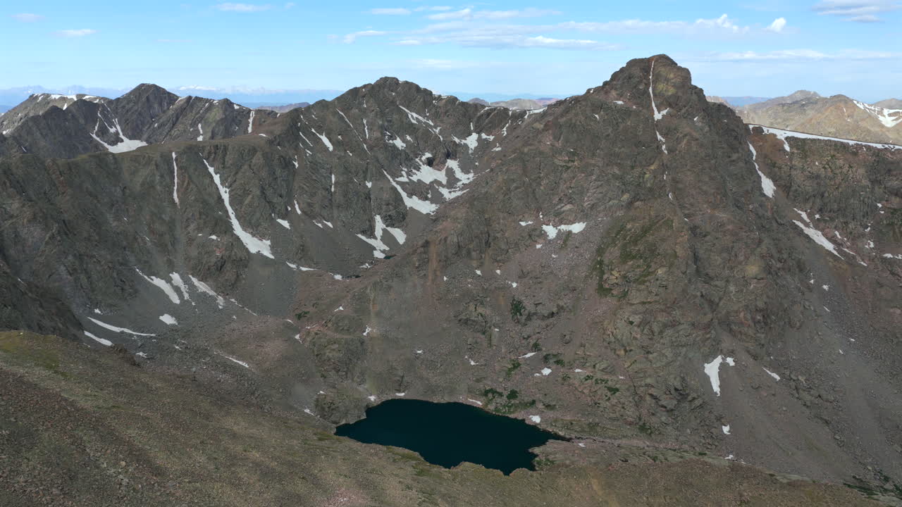 Mount of the Holy Cross 14er prominent peak wilderness landscape view aerial drone Colorado morning clouds North Mountain Shelter Halo Ridge Bowl Of Tears Alpine Lake Rocky Mountains backwards up