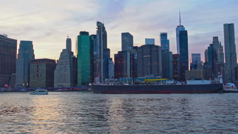 iconic view of manhattan with east river and skyscrapers