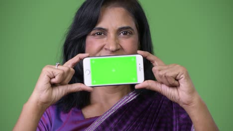 mature beautiful indian woman showing phone