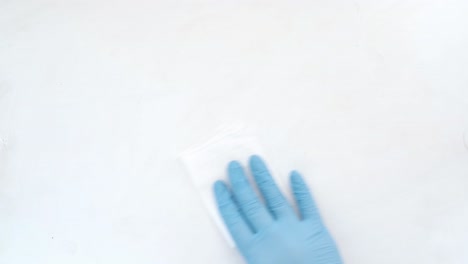 cleaning a surface with gloves