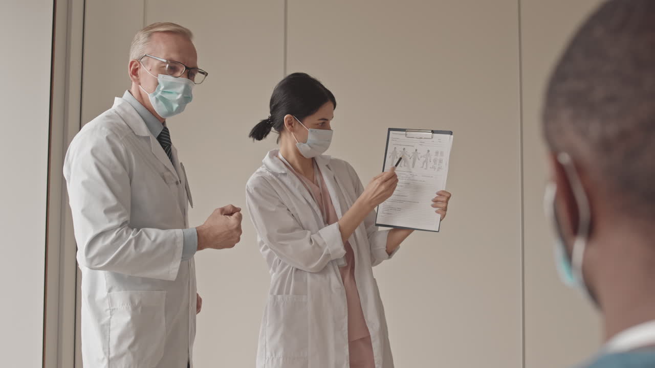 Medical Professionals Discussing Patient Report