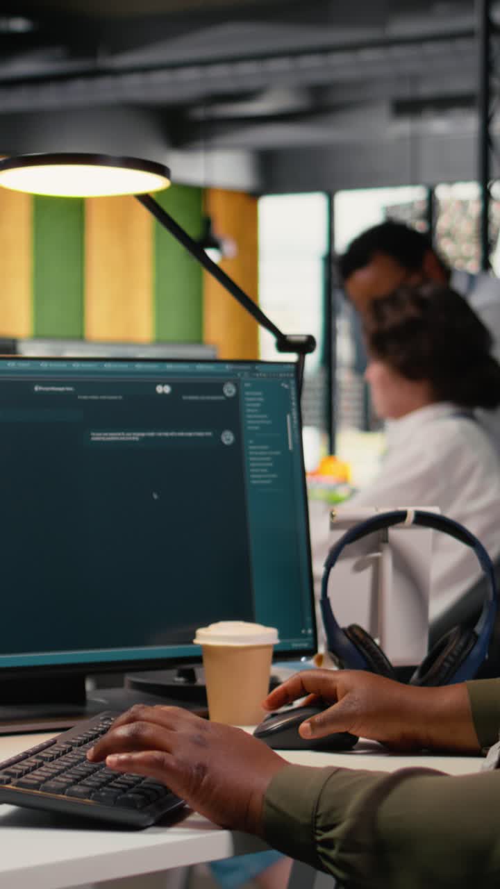 Vertical video Software developer in office solving tasks with AI LLM chatbot answering prompts