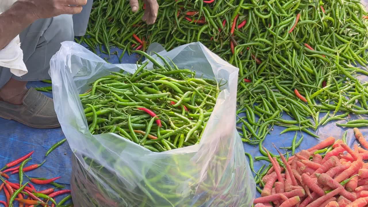 A huge pile of fresh green chillies