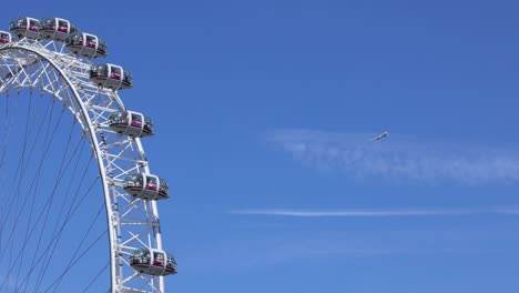 ferris wheel with airplane in clear sky