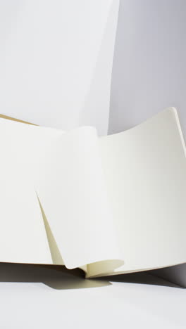 video of books with white blank pages with copy space on white background
