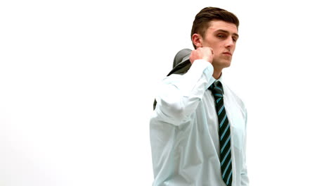 businessman putting jacket over his shoulder