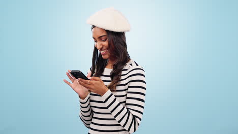 Phone,-smile-and-woman-in-a-studio-typing-message