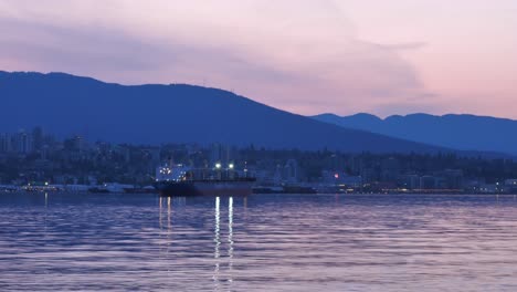 Docked-Pacific-Basin-Dry-Bulk-Ship-with-a-View-of-the-Mountain-and-the-City-Skyline-Static