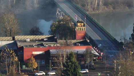 jacob haldi bridge over the fraser river at sunrise in fort langley, bc, canada. - aerial shot