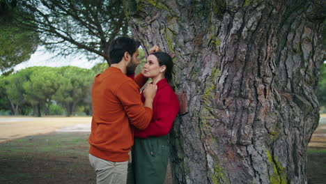 romantic couple standing forest spending weekend together. pair relaxing nature