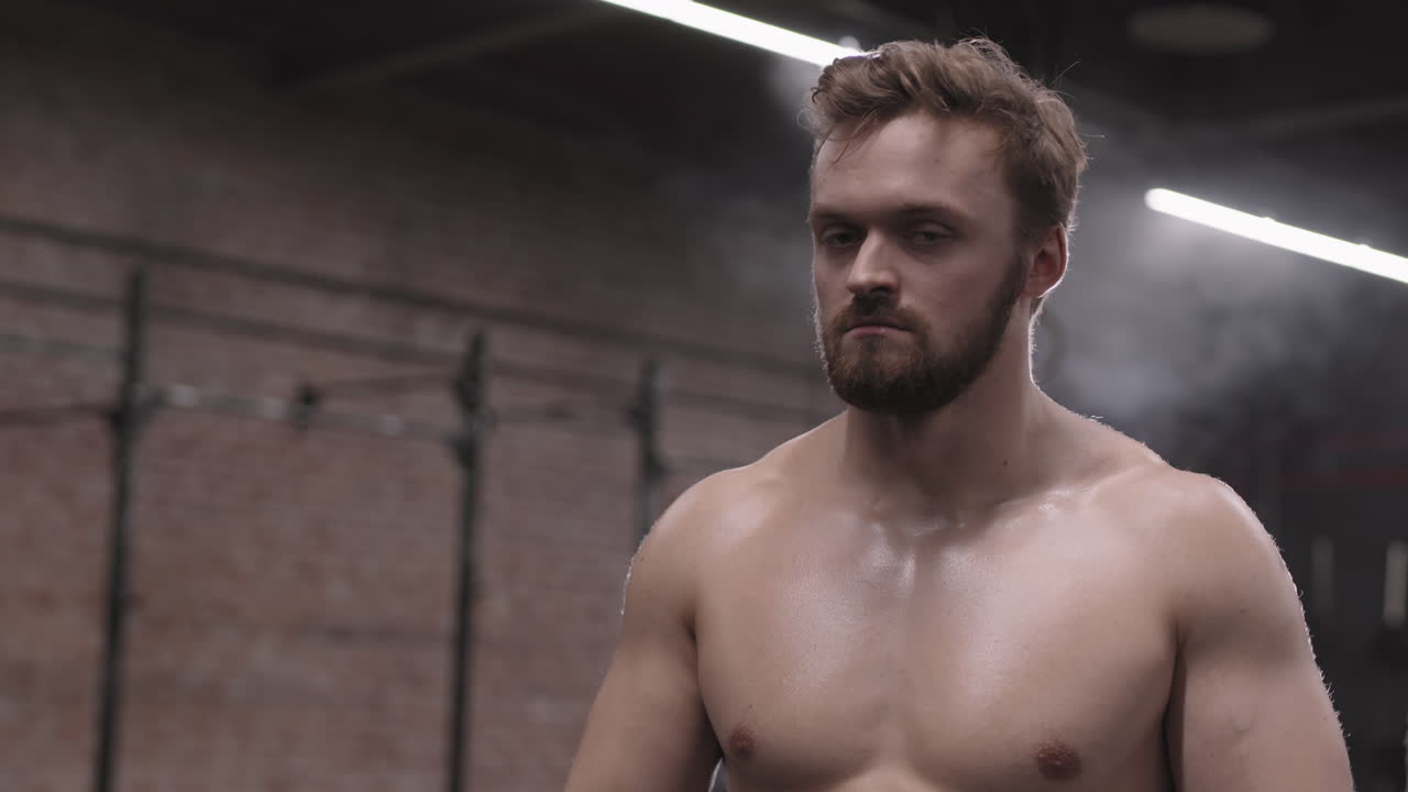 Portrait of Muscular Caucasian Sportsman after Training