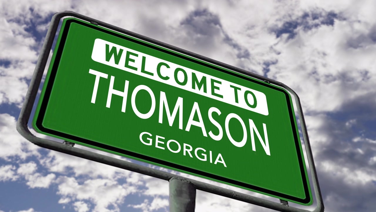 Welkom in Thomason, Georgia, VS. Close-up van een realistisch 3D-geanimeerd stadsnaambord.